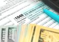 Tax form 1040 US American IRS Internal Revenue Service income tax background photo