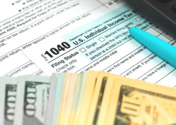 Tax form 1040 US American IRS Internal Revenue Service income tax background photo