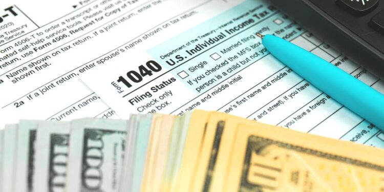 Tax form 1040 US American IRS Internal Revenue Service income tax background photo