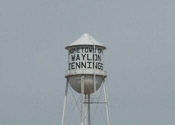 A municipal water tower over a Texas town