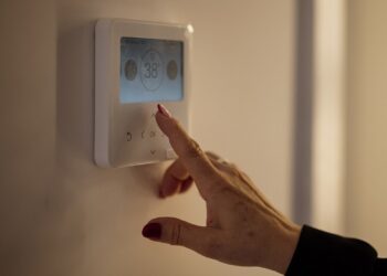 A home thermostat on a wall