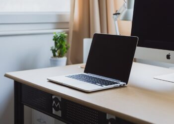 Modern laptop open on a home office desk
