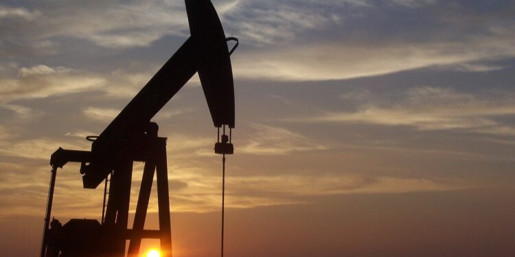 A pumpjack silhouetted against the sunset in West Texas