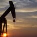 A pumpjack silhouetted against the sunset in West Texas