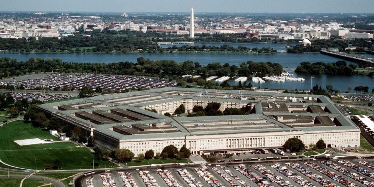 Aerial view of the Pentagon with the Washington Monument in the background