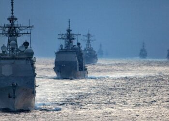 U.S. Navy guided-missile cruisers and destroyers cruising in formation
