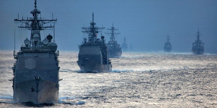 U.S. Navy guided-missile cruisers and destroyers cruising in formation